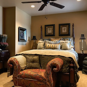 Guest bedroom with carpet, luxury bedding and accessories